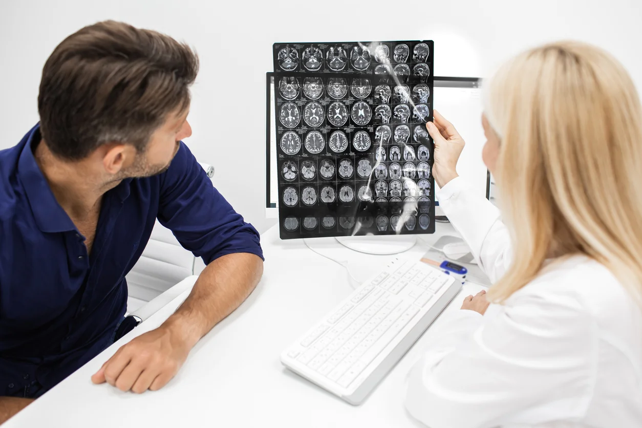 Traumatic brain injury lawyers in Texas reviewing an MRI scan