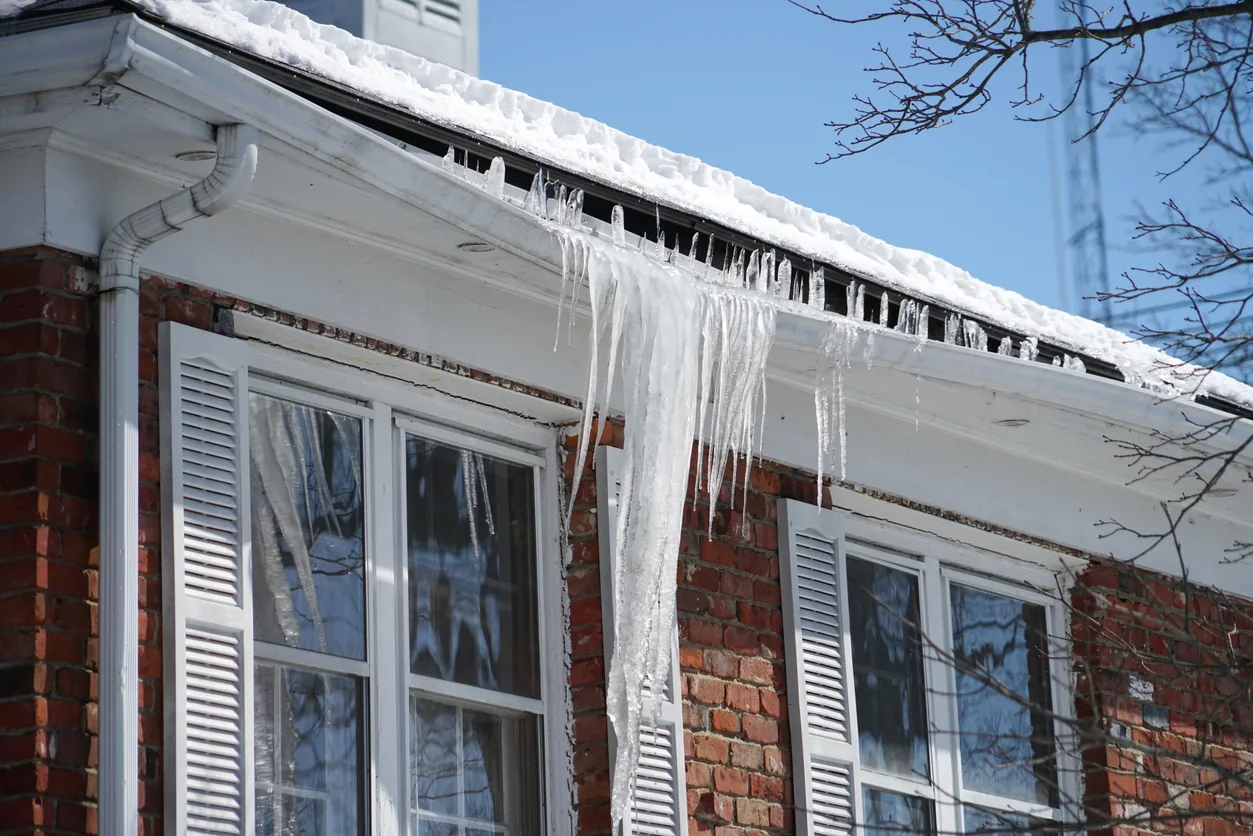 Ice dams on rooftop after solar panel installation